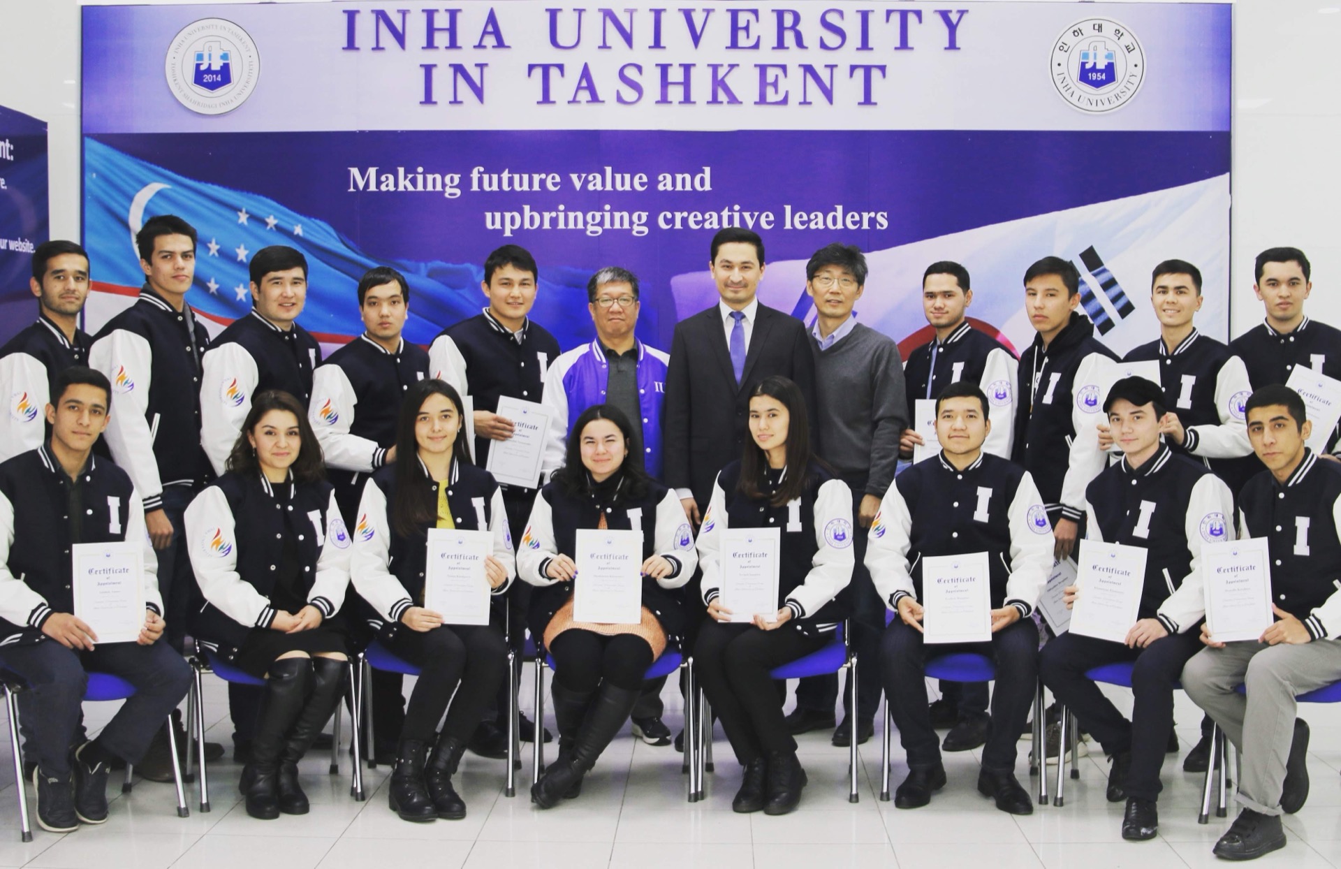 Khurshid Normurodov with graduating students at INHA University in Tashkent