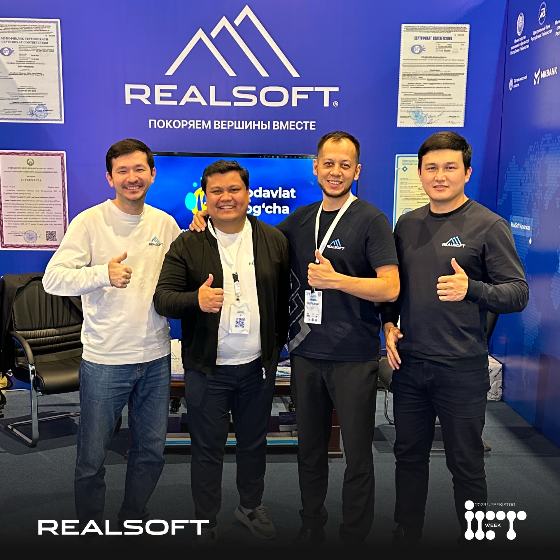Khurshid Normurodov and RealSoft colleagues giving thumbs up at the RealSoft booth during ICT Week