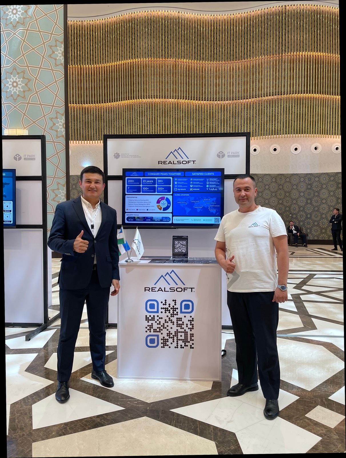 Khurshid Normurodov and a colleague at the RealSoft booth during an IT Park expo