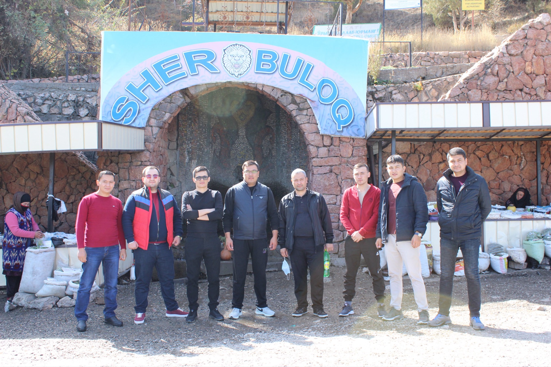 Khurshid Normurodov with colleagues at the Sher Buloq spring landmark